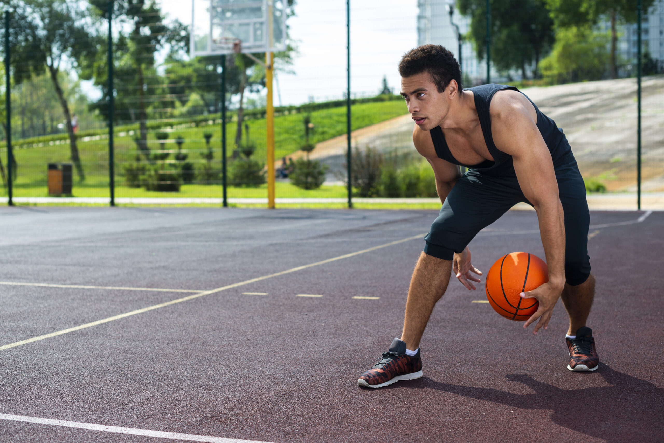 man-playing-basketball-park-court-scaled-1.jpg